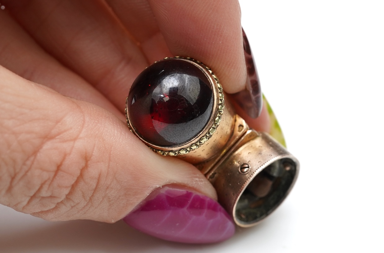 A gold and garnet perfume bottle top, France, late 19th century